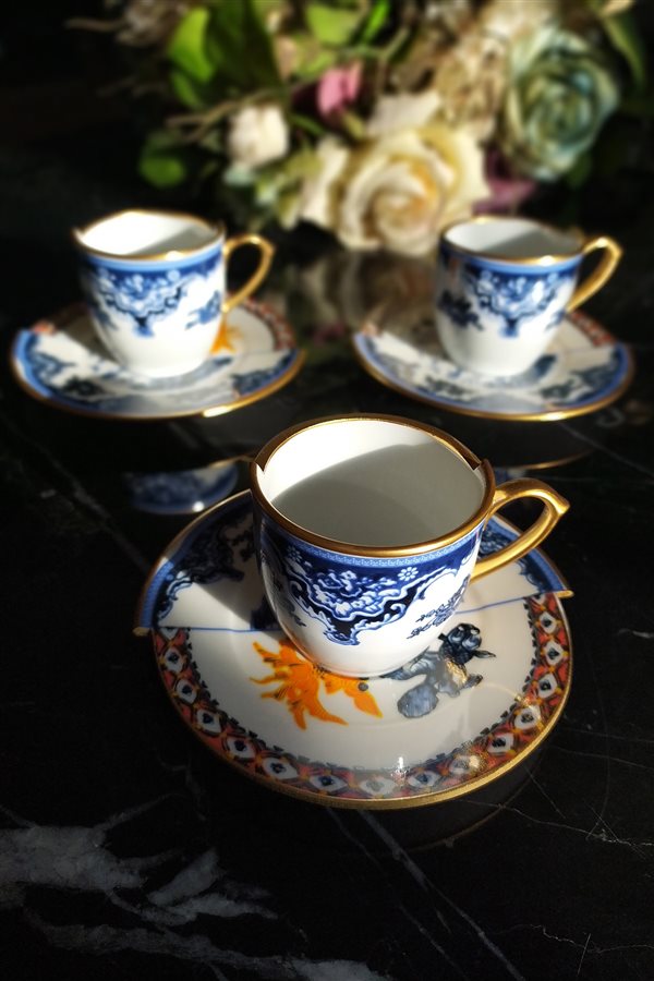 Two Patterned 6 White Coffee Cups